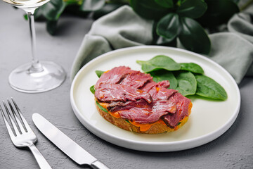 Gourmet beef tenderloin on toast with spinach