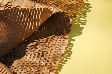 Packaging of eco-materials. Packaging paper on a yellow background. Concept saving the planet from...