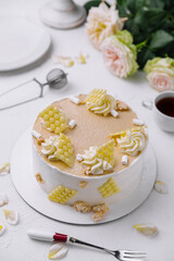 Elegant vanilla cake with whipped cream and honeycomb