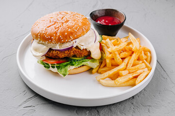 Classic cheeseburger with fries and ketchup