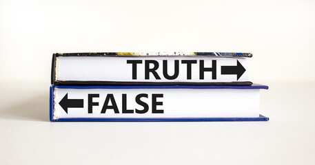 Truth or false symbol. Concept word Truth or False on beautiful books. Beautiful white table white background. Business and truth or false concept. Copy space.