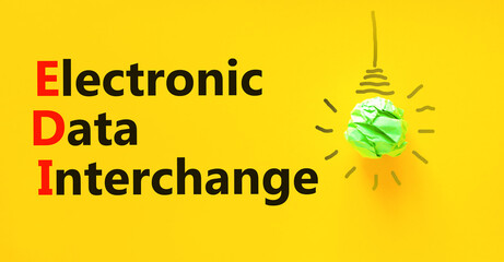EDI electronic data interchange symbol. Concept words EDI electronic data interchange on yellow paper on a beautiful yellow background. Business and EDI electronic data interchange concept. Copy space