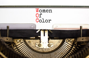 WOC women of color symbol. Concept words WOC women of color typed on beautiful old retro typewriter. Beautiful white background. Business WOC women of color social issues concept. Copy space. - obrazy, fototapety, plakaty