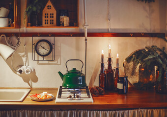 Festive winter cozy kitchen interior with garlands, decorations and gifts