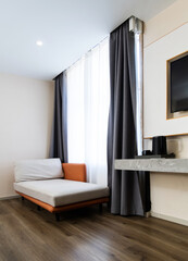A sofa in the corner of the room
