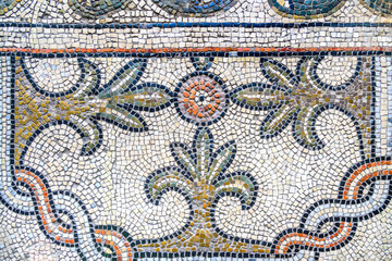 Part of an old mosaic floor, with floral and geometric patterns