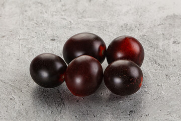 Raw ripe black kumato tomato