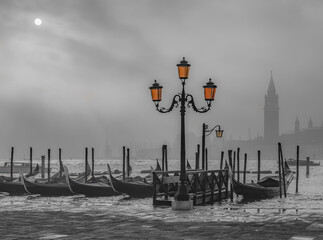 Gondolas in Venice at sunrise in morning fog. Veneto, Italy.. - 787051418