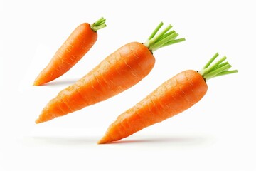 Three fresh carrots falling on white background