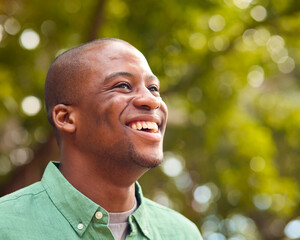Close Up Portrait Of Smiling Man Outdoors In Countryside Or Garden