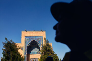 Woman looking at Gur Emir Mausoleum in Samarkand - 787054054