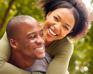 Portrait Of Loving Couple Hugging Outdoors In Countryside Or Garden