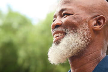 Close Up Portrait Of Smiling Senior Man Outdoors In Countryside Or Garden