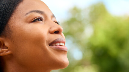 Close Up Portrait Of Smiling Woman Outdoors In Countryside Relaxing