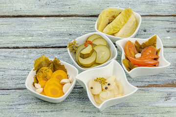 Assorted fermented vegetables. Probiotics, healthy food, vitamins. Vegan lifestyle, pickled dish