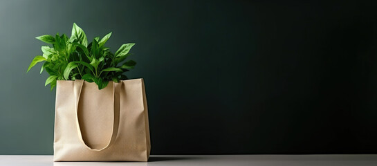 Shopping Bag with Green Plant Leaves on Dark Background with Copy Space