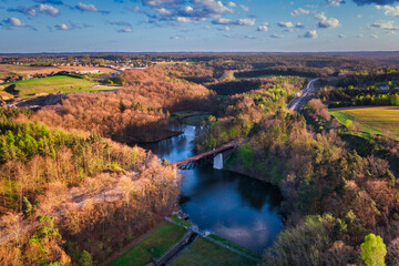 Fototapeta na wymiar Spring landscape of the forest and twisted Radunia river in Kashubia. Poland