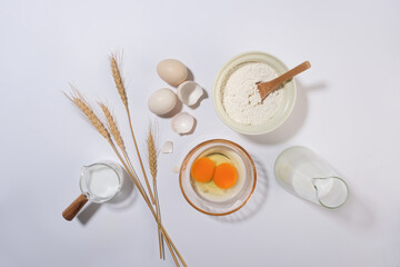 Kitchen background of cooking concepts, flay lay ingredients with egg, flour and milk. Photo for...