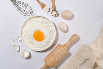 Dough preparation recipe with homemade cake ingredients flat lay on kitchen counter top background....