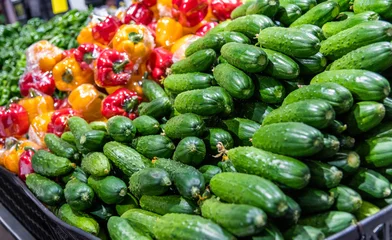 Plexiglas foto achterwand Pile of fresh cucumbers in market © xy