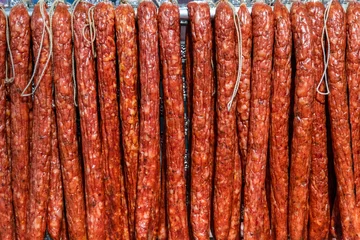 Plexiglas foto achterwand Chinese long sausages in market © xy