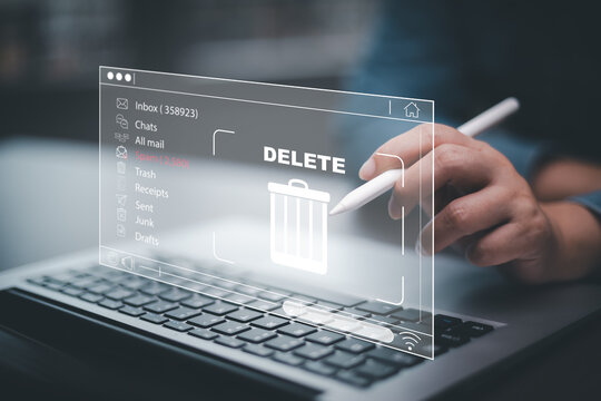 The programmer's hand is tapping on the file icon under the concept of data deletion. The concept  technology and document management.data deletion and removal - Powered by Adobe