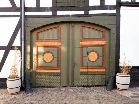 Nicely painted wooden double doors of half-timbered house in Bogense, Funen, Denmark