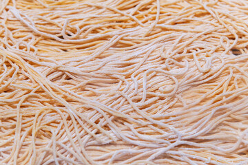 Fresh raw noodles in market