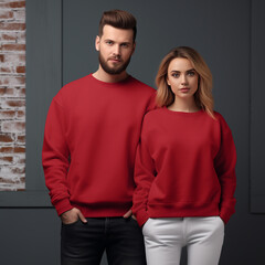 Fototapeta premium Young woman and man couple mockup. Cherry red sweatshirt on models mockup. Family, couple matching shirts template. Front view of pulover. Husband and wife or girlfriend with boyfriend indoor mock