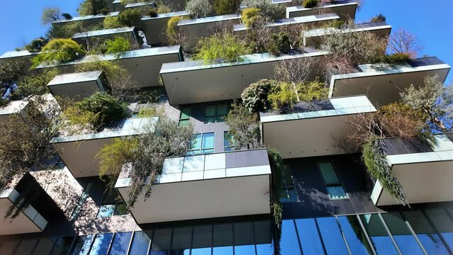 Slow vertical panorama of famous bosco verticale in Milan