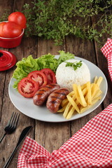 sausage, french fries and salad