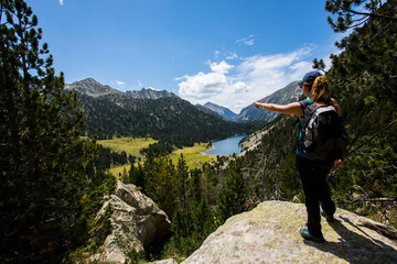 Young hiker woman in Vall de Boi, Aiguestortes and Sant Maurici National Park, Spain