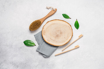 Morning body care accessories. Massage, bamboo toothbrushes on a light background with copy space