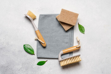 Cleaning supplies on a light background with copy space. Brushes and rags, gentle eco-cleaning