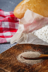 Granulated dry yeast on a dark rustic background