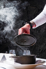 Chef cooking soup in the kitchen at restaurant. - 787083869