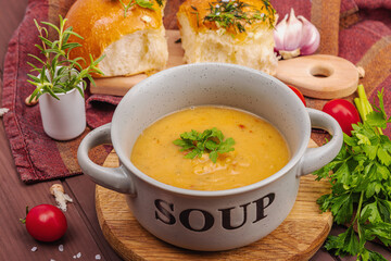 Chickpea-tomato cream soup with fragrant garlic buns. Comfort food, nostalgic mood concept