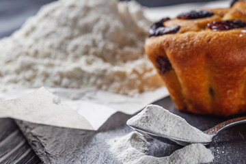 muffins baked with baking powder on a black wooden rustic background
