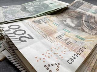pile of  PLN 100 200 banknote Polish Zloty money background - obrazy, fototapety, plakaty