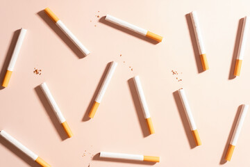 World no tobacco day concept template. Flat layout of cigarettes or tobacco on brown background.