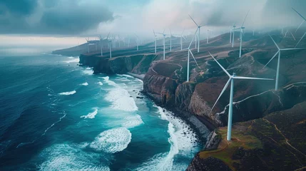 Gordijnen Wind turbines against a sunrise coastal landscape © Lubos Chlubny