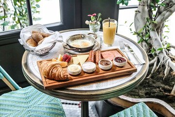 Table With Food Tray Next to Window