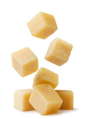 Cheese cubes falling on a pile on a white background. Isolated