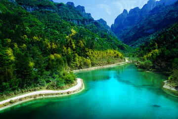 lake in the mountains Green mountains, bright skies, blue rivers, and small streets. The popular...