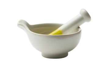 White porcelain mortar and pestle with yellow and green
isolated on white background
