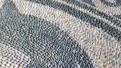 floor made of gray and white sea stones