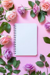 Notebook Surrounded by Flowers on Pink Background