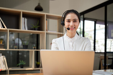 Call center friendly woman asian in office for customer service, technical support and advice,...