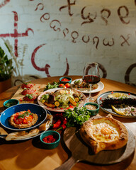 Eastern cuisine. Georgian fresh salad. Georgian national cuisine, food on the table in the restaurant. Oriental food. Authentic traditional meals