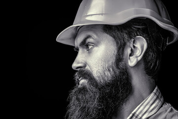Bearded man wears helmet. Building, development, profession concept. Builder in hard hat, foreman...